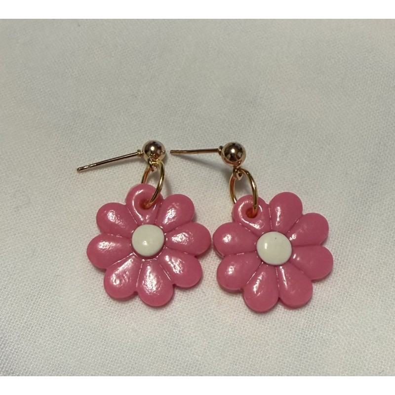 beautiful, small bright pink flower with gold details